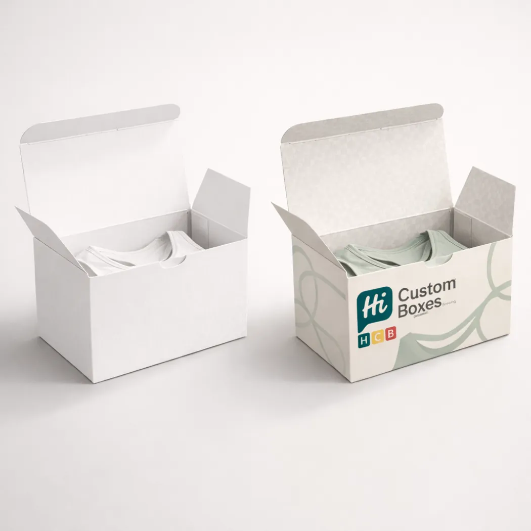 Two open tuck-top boxes side-by-side- showcasing internal branding and a pale green garment inside- class=